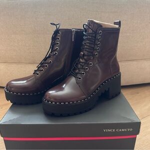 NEVER WORN Vince Camuto combat booties in the color eggplant. Size 7 1/2